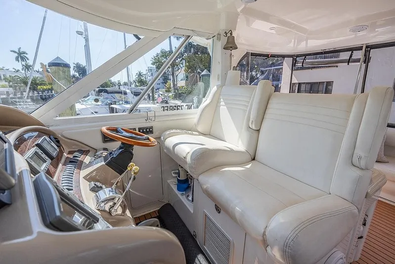Pure Drive Yacht Photos Pics 2005 Sea Ray 390 Motor Yacht interior with white leather seating and modern controls.
