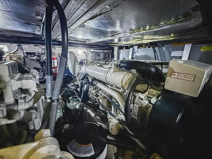 Pure Drive Yacht Photos Pics Engine room of a 2005 Sea Ray 390 Motor Yacht, showcasing mechanical components and wiring.