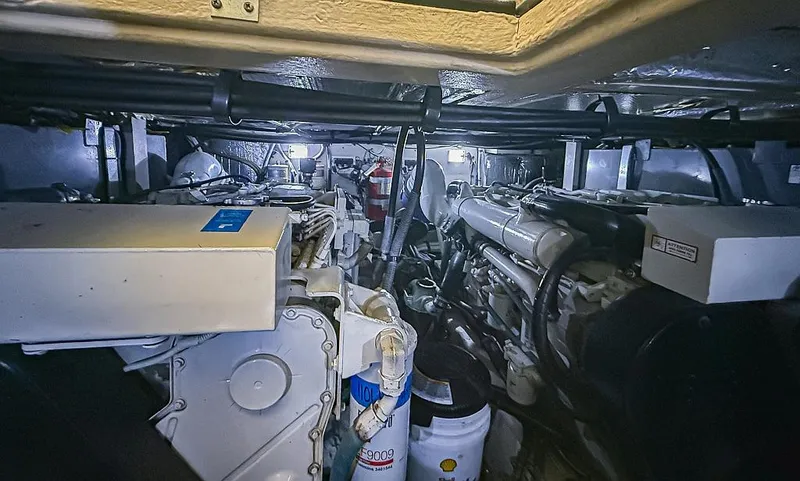 Pure Drive Yacht Photos Pics Engine room of 2005 Sea Ray 390 Motor Yacht, showcasing machinery and equipment.