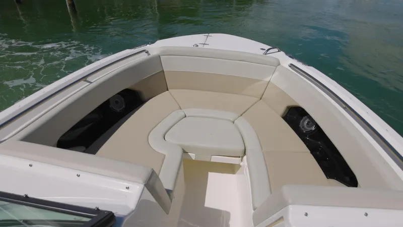 Yacht Photos Pics 2023 Boston Whaler 240 Vantage boat interior with beige seating and open water view.