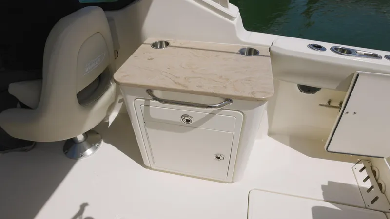  Yacht Photos Pics 2023 Boston Whaler 240 Vantage interior with seating and storage compartment.