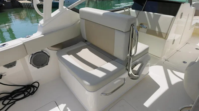  Yacht Photos Pics 2023 Boston Whaler 240 Vantage boat interior with cushioned seating and stainless steel accents.