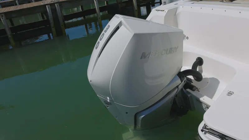 Yacht Photos Pics 2023 Boston Whaler 240 Vantage with Mercury outboard engine in water.