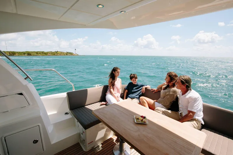  Yacht Photos Pics Family enjoying a sunny day on a 2020 Prestige 460 yacht, ocean view.