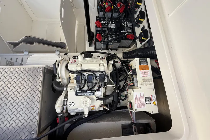  Yacht Photos Pics Engine compartment of 2022 Sea Ray Sundancer 320 Outboard with visible wiring and components.