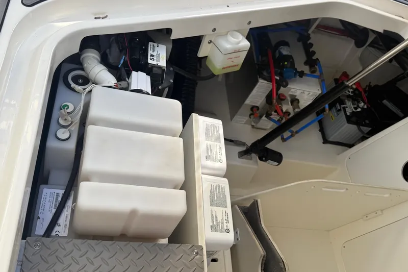  Yacht Photos Pics 2022 Sea Ray Sundancer 320 Outboard engine compartment with batteries and fluid containers.