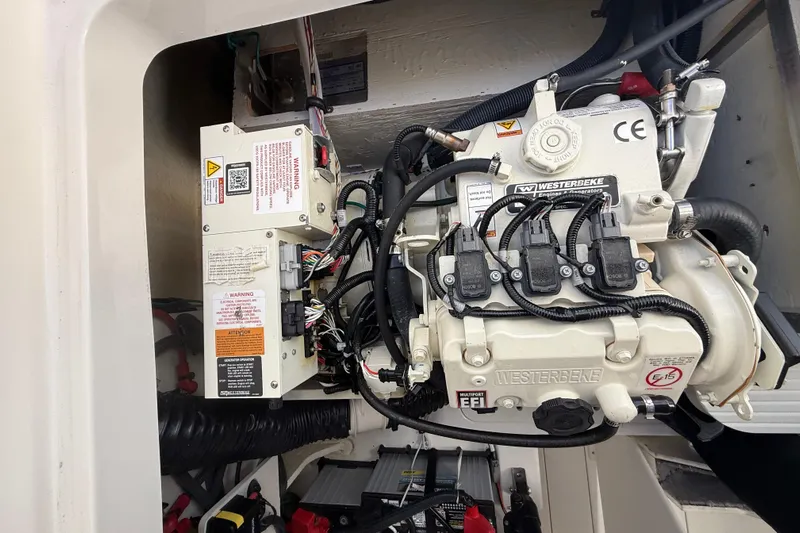  Yacht Photos Pics Engine compartment of 2022 Sea Ray Sundancer 320 Outboard with Westerbeke generator.