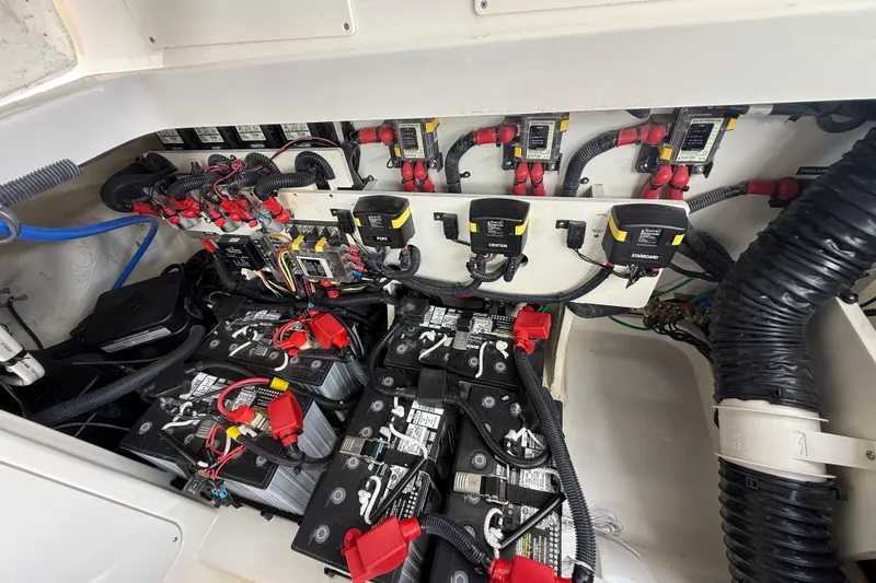  Yacht Photos Pics Engine compartment of 2022 Sea Ray Sundancer 320 Outboard with batteries and wiring.