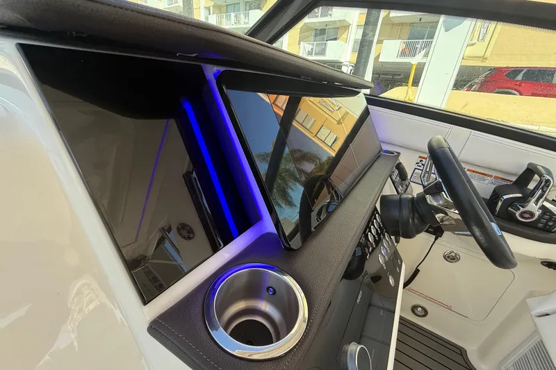  Yacht Photos Pics 2022 Sea Ray Sundancer 320 Outboard helm with modern controls and sleek design.
