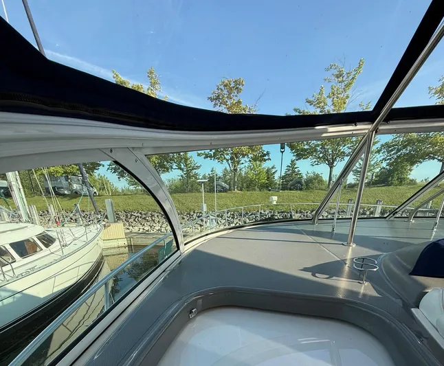 Ciel Rouge Yacht Photos Pics Interior view of 2006 Cruisers Yachts 420 Express, showcasing sleek design and marina setting.