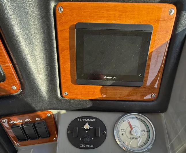 Ciel Rouge Yacht Photos Pics Control panel of 2006 Cruisers Yachts 420 Express with Garmin display and searchlight controls.