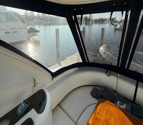 Ciel Rouge Yacht Photos Pics Interior view of 2006 Cruisers Yachts 420 Express with marina backdrop.