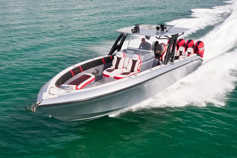  Yacht Photos Pics 2025 Midnight Express 37' Open boat cruising on clear turquoise water.