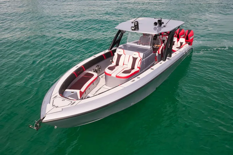  Yacht Photos Pics 2025 Midnight Express 37' Open boat on clear water, featuring sleek design and modern seating.