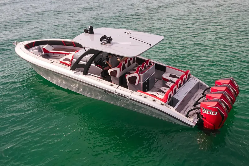  Yacht Photos Pics 2025 Midnight Express 37' Open boat with red seating and multiple outboard engines on clear water.