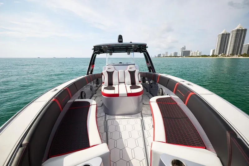  Yacht Photos Pics 2025 Midnight Express 37' Open boat interior with luxurious seating, ocean view, and city skyline.