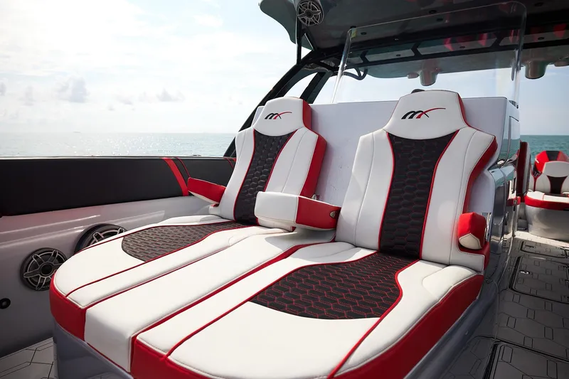  Yacht Photos Pics Luxurious seating on 2025 Midnight Express 37' Open boat, featuring sleek red and white design.