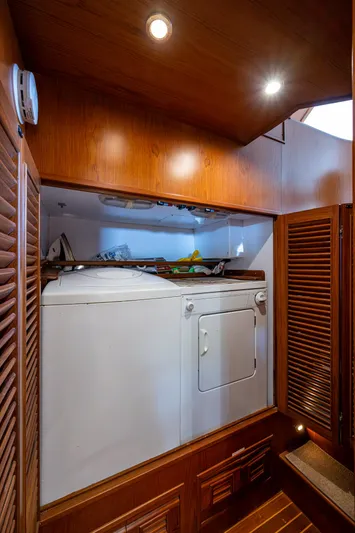  Yacht Photos Pics Laundry area inside 2000 Offshore Yachts 58 Pilot House, featuring washer and dryer.