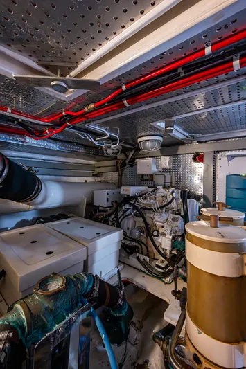  Yacht Photos Pics Engine room of 2000 Offshore Yachts 58 Pilot House, showcasing mechanical components.
