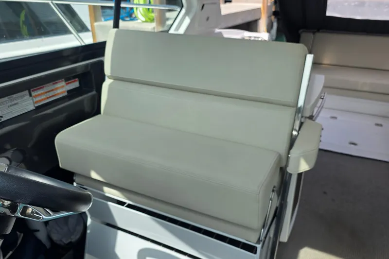  Yacht Photos Pics 2017 Monterey 360 Sport Coupe interior with beige seating and steering wheel.