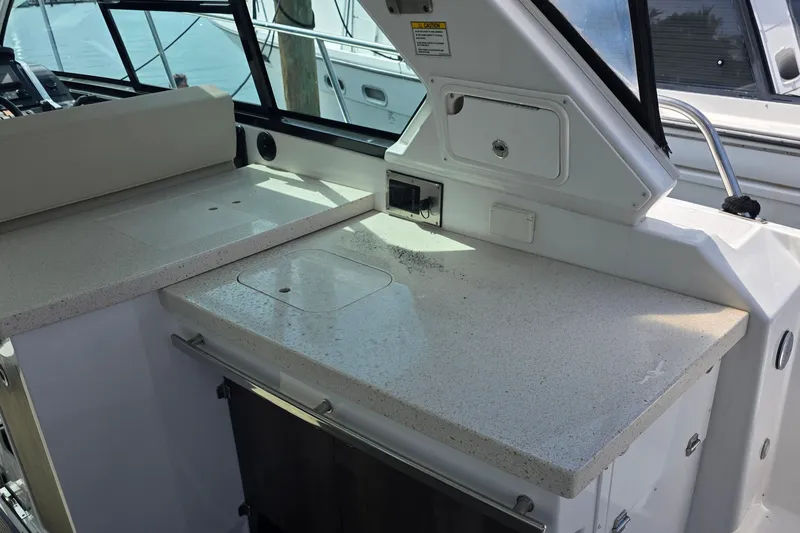  Yacht Photos Pics 2017 Monterey 360 Sport Coupe boat interior with sleek countertop and storage compartments.