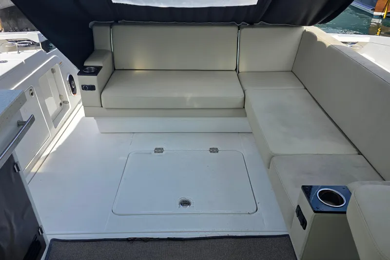  Yacht Photos Pics 2017 Monterey 360 Sport Coupe interior with beige seating and cup holders.