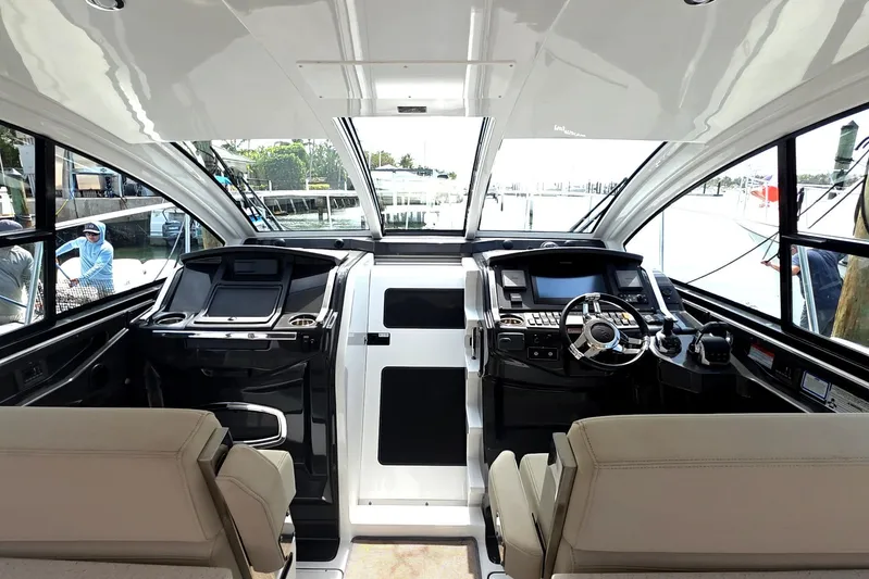  Yacht Photos Pics Interior of 2017 Monterey 360 Sport Coupe yacht with modern helm and seating.