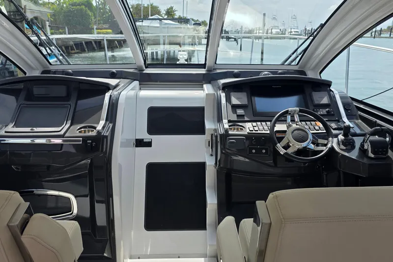 Yacht Photos Pics 2017 Monterey 360 Sport Coupe helm with modern controls and panoramic view.