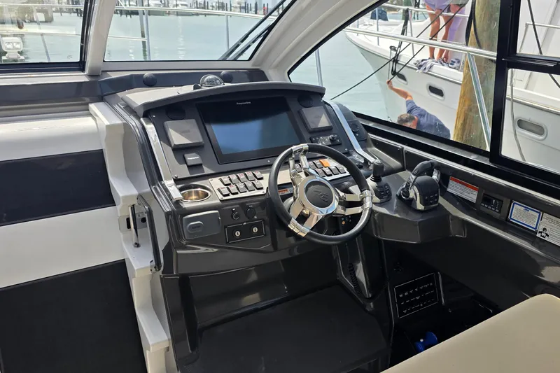  Yacht Photos Pics Cockpit of 2017 Monterey 360 Sport Coupe with modern controls and steering wheel.