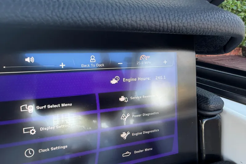  Yacht Photos Pics 2022 Nautique Super Air Nautique G23 Coastal Edition dashboard display showing engine hours and settings.