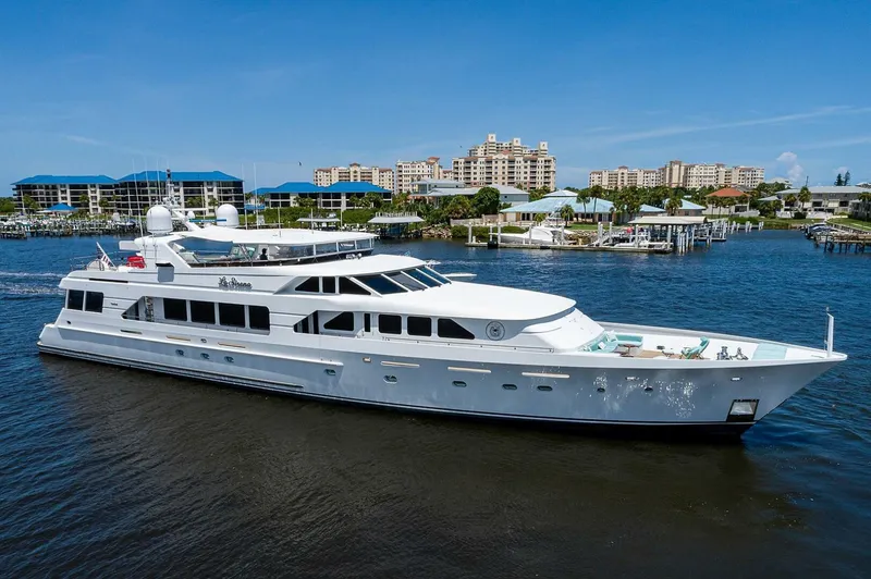La Sirena Yacht Photos Pics Luxury Christensen 141 Raised Pilothouse yacht from 2000, docked in a scenic marina.