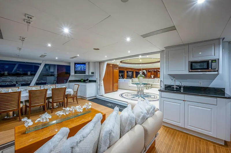 La Sirena Yacht Photos Pics Luxurious interior of 2000 Christensen 141 Raised Pilothouse yacht with elegant dining and lounge areas.