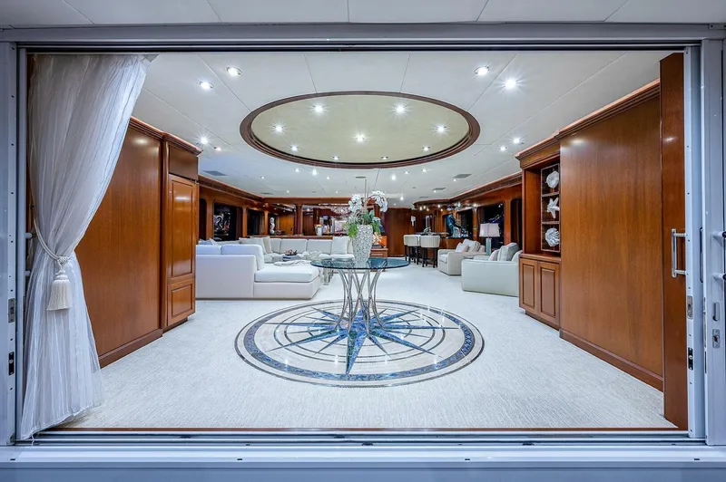 La Sirena Yacht Photos Pics Luxurious interior of 2000 Christensen 141 Raised Pilothouse yacht with elegant wood paneling.