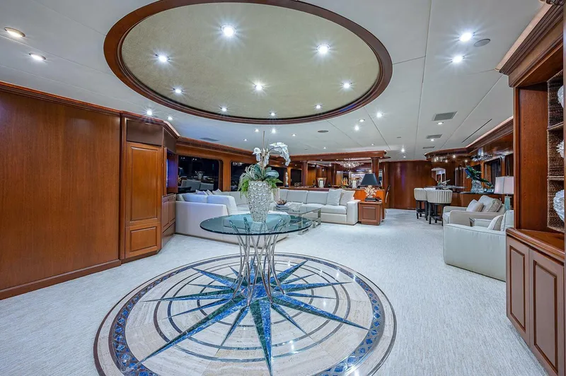 La Sirena Yacht Photos Pics Luxurious interior of 2000 Christensen 141 Raised Pilothouse yacht with elegant decor and seating.