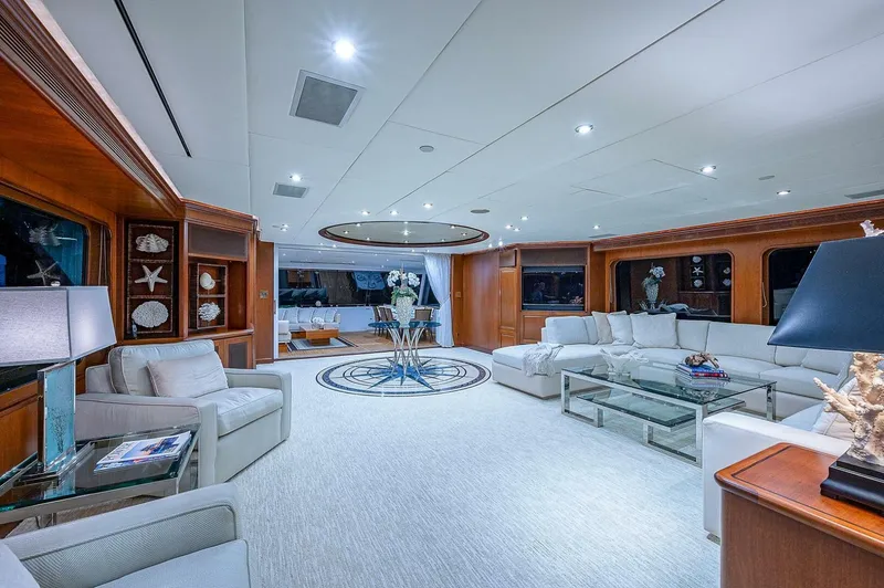 La Sirena Yacht Photos Pics Luxurious interior of 2000 Christensen 141 Raised Pilothouse yacht, featuring elegant seating and decor.
