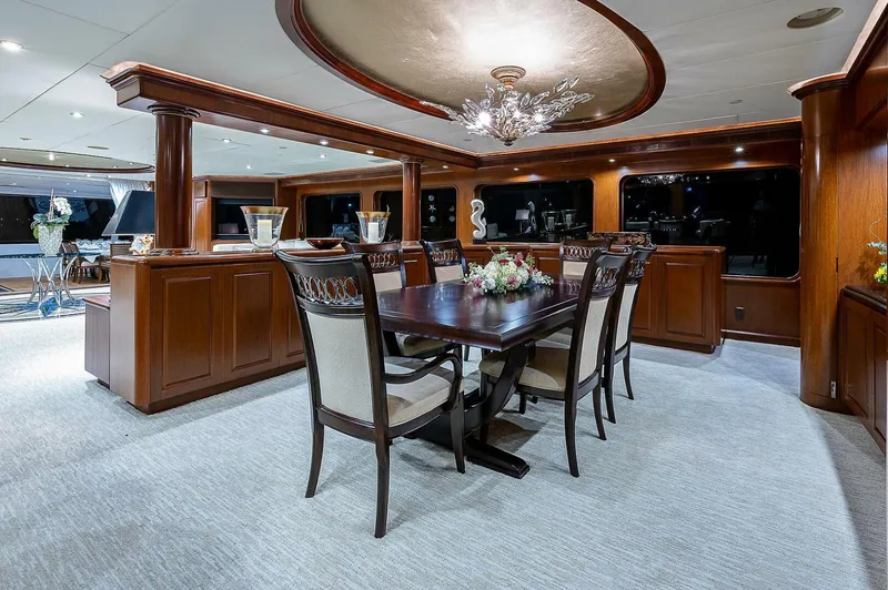 La Sirena Yacht Photos Pics Luxurious dining area on a 2000 Christensen 141 Raised Pilothouse yacht with elegant wood finishes.