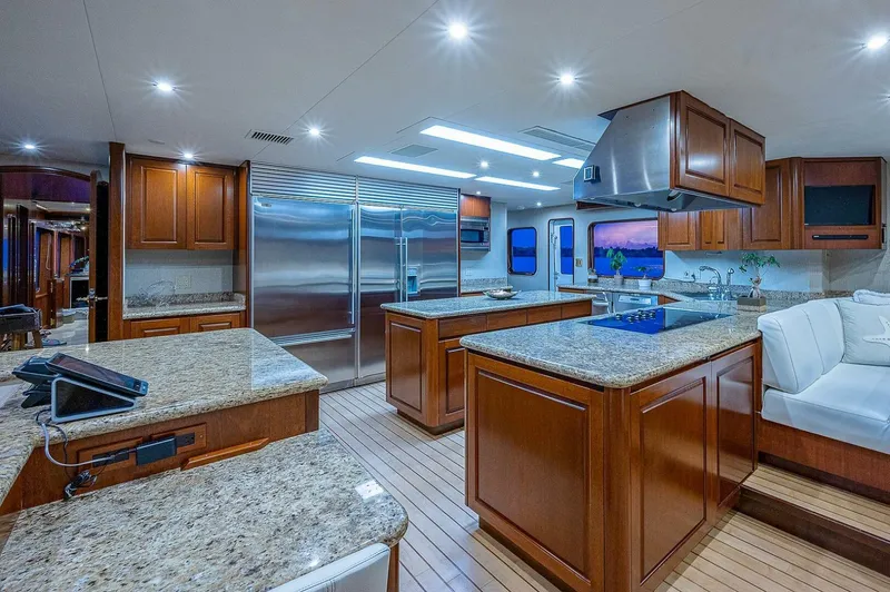 La Sirena Yacht Photos Pics Luxurious kitchen interior on 2000 Christensen 141 Raised Pilothouse yacht with granite countertops.