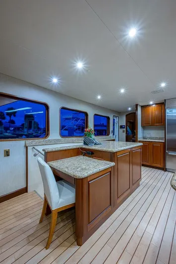 La Sirena Yacht Photos Pics Luxurious interior of 2000 Christensen 141 Raised Pilothouse yacht with elegant wood and granite finishes.