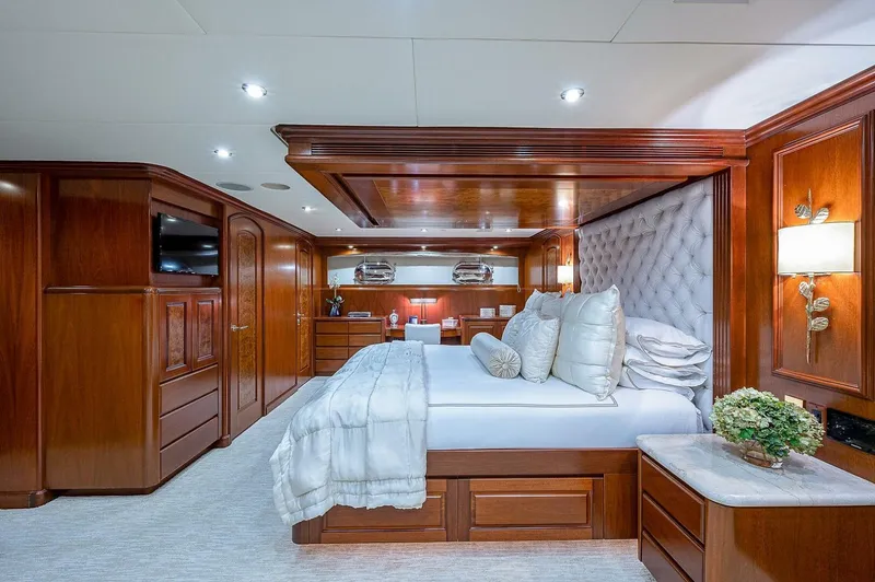 La Sirena Yacht Photos Pics Luxurious bedroom in 2000 Christensen 141 Raised Pilothouse yacht with elegant wood paneling.