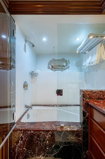 La Sirena Yacht Photos Pics Luxurious bathroom with marble accents in a 2000 Christensen 141 Raised Pilothouse yacht.