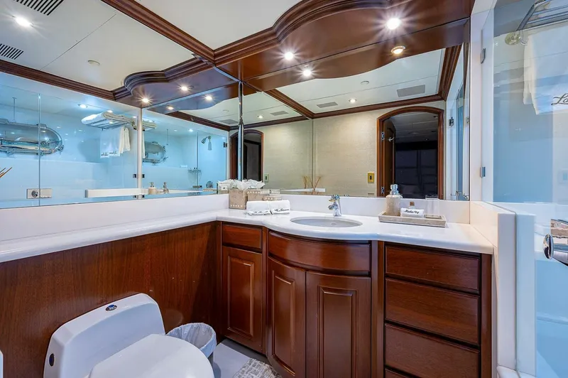 La Sirena Yacht Photos Pics Luxurious bathroom on 2000 Christensen 141 Raised Pilothouse yacht with elegant wood cabinetry.