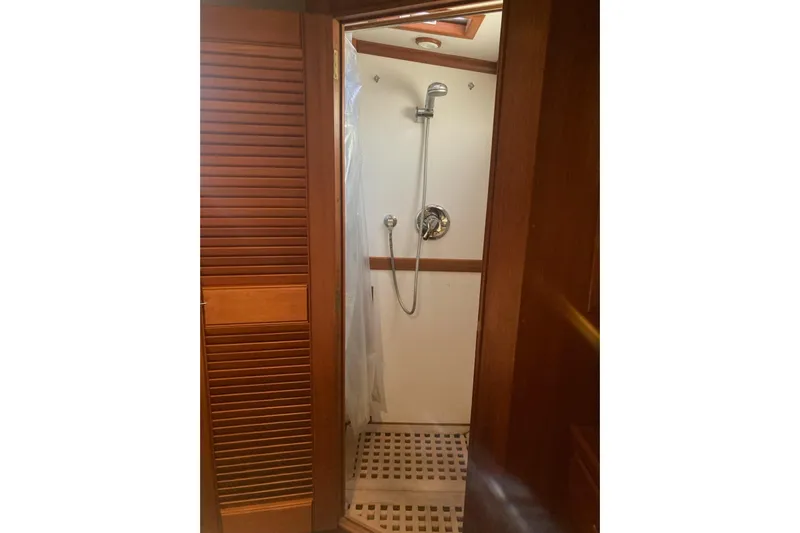 Gb421500 Yacht Photos Pics Shower area in 2002 Grand Banks 42 Classic yacht with wooden accents.