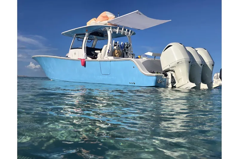  Yacht Photos Pics 2020 Sportsman Open 352 Center Console boat on clear water under blue sky.