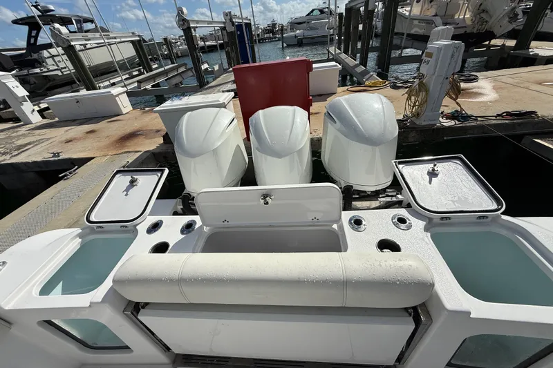  Yacht Photos Pics 2020 Sportsman Open 352 Center Console with triple outboard engines at a marina dock.