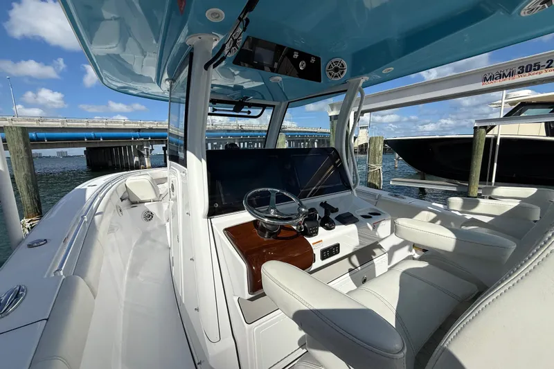  Yacht Photos Pics 2020 Sportsman Open 352 Center Console boat interior with helm and seating.