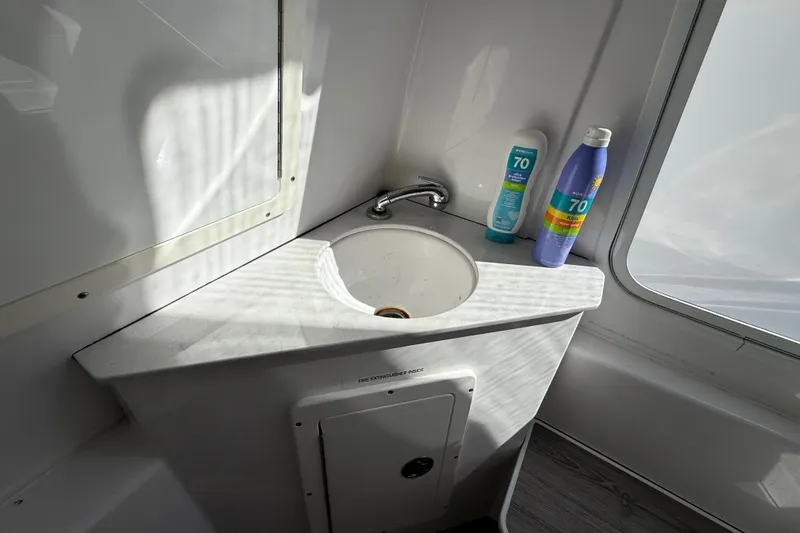  Yacht Photos Pics 2020 Sportsman Open 352 Center Console sink area with sunscreen bottles.