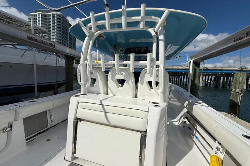  Yacht Photos Pics 2020 Sportsman Open 352 Center Console boat docked in marina, clear sky background.