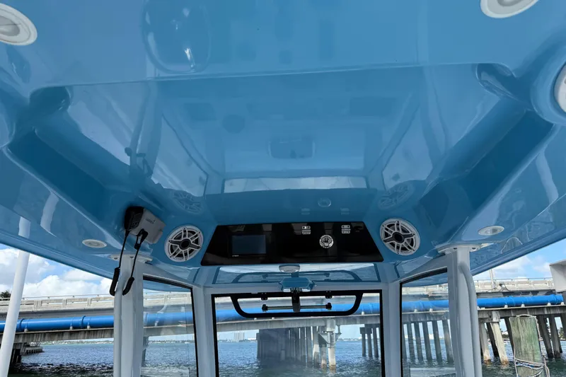  Yacht Photos Pics 2020 Sportsman Open 352 Center Console boat interior with blue ceiling and speakers.
