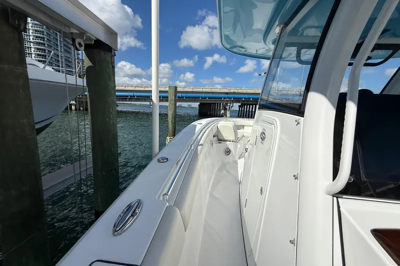  Yacht Photos Pics 2020 Sportsman Open 352 Center Console docked near a bridge, under a clear sky.