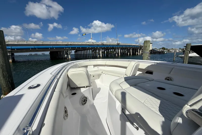  Yacht Photos Pics 2020 Sportsman Open 352 Center Console boat interior near a bridge on a sunny day.